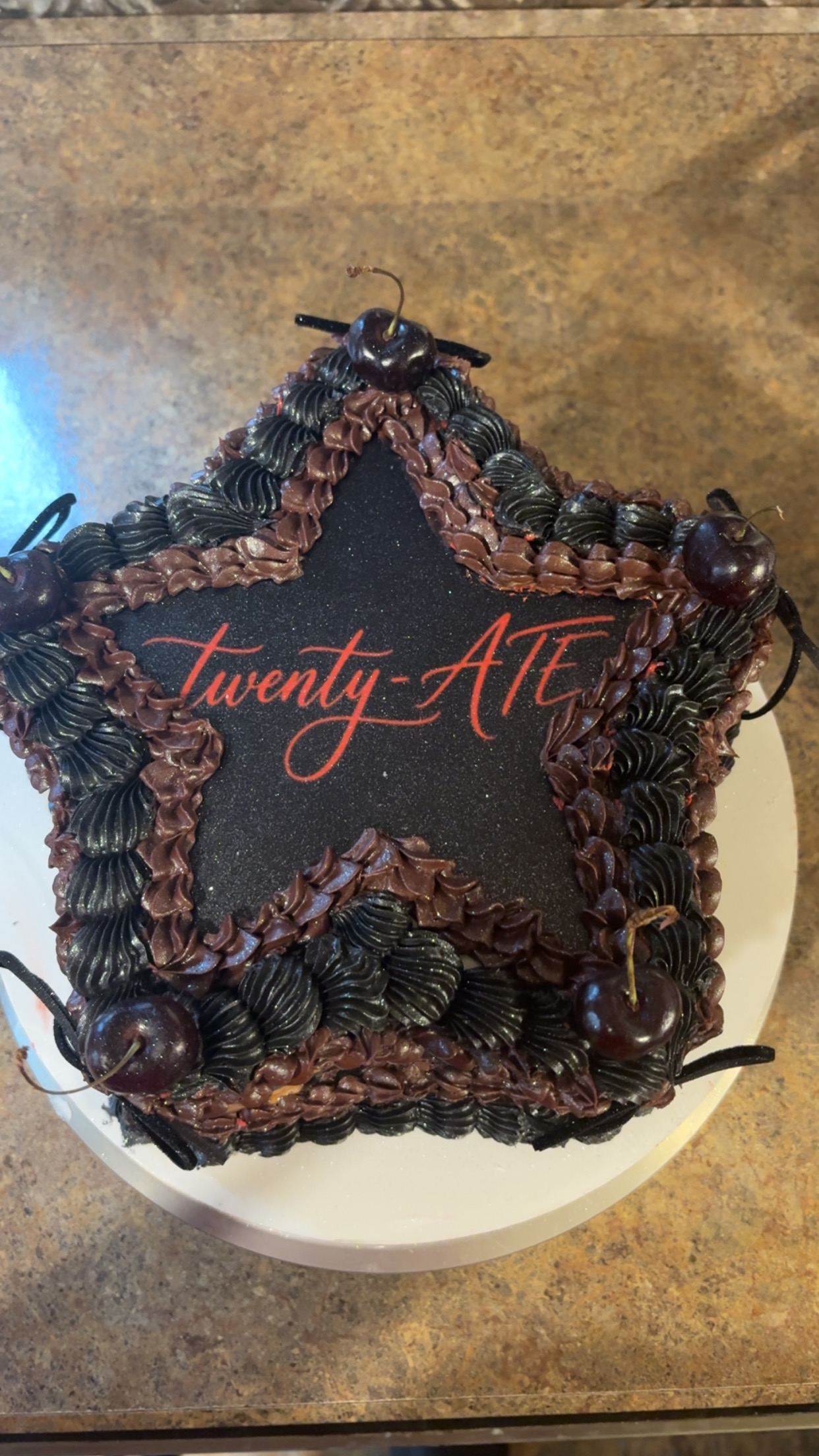 Twenty-ATE star-shaped chocolate birthday cake